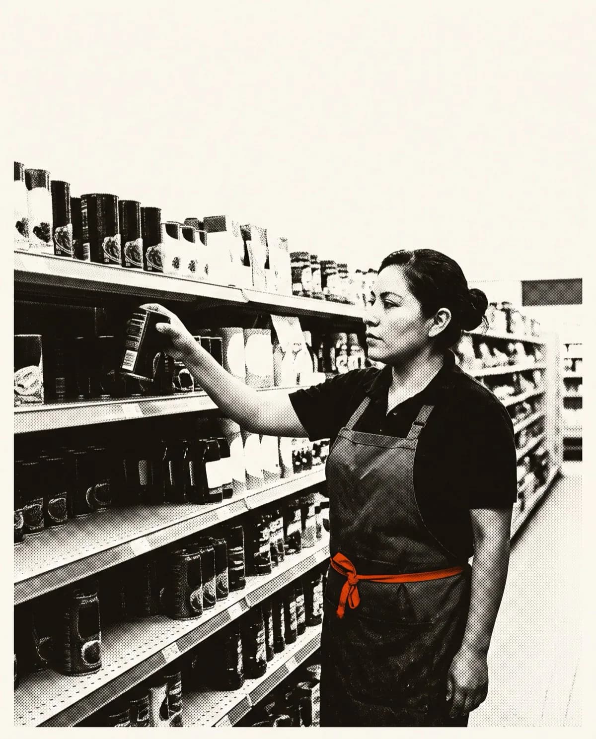 Store associate restocking product on a supermarket shelf.